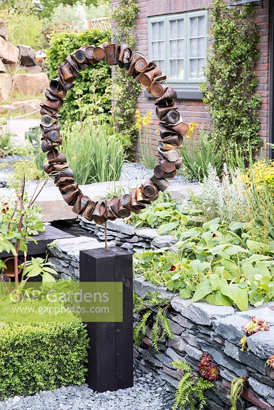 Rusted tin can sculpture - The Great Chelsea Garden Challenge