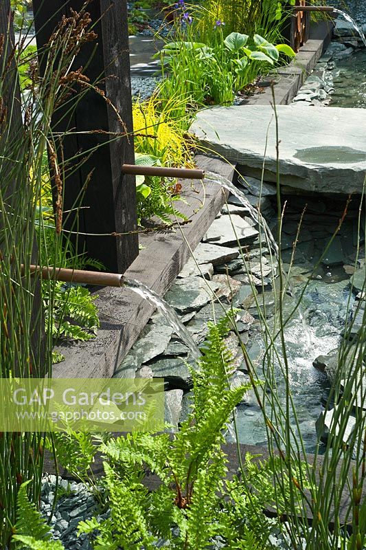 Slate water feature in The RHS Great Chelsea Challenge Garden.  RHS Chelsea Flower Show 2015