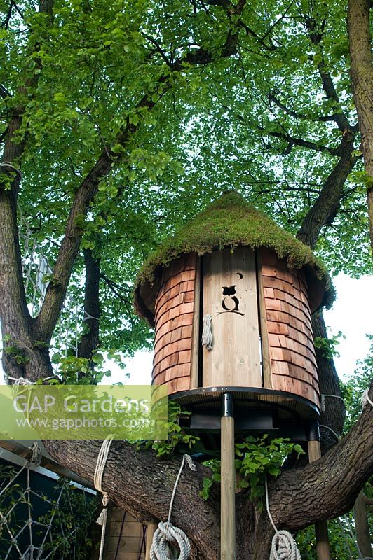 Treehouse built in mature tree. RHS Chelsea Flower Show 2015