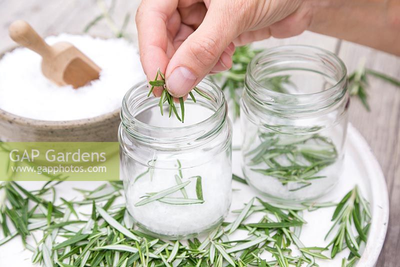 In glass jars create layers of sea salt then rosemary until the jar is full