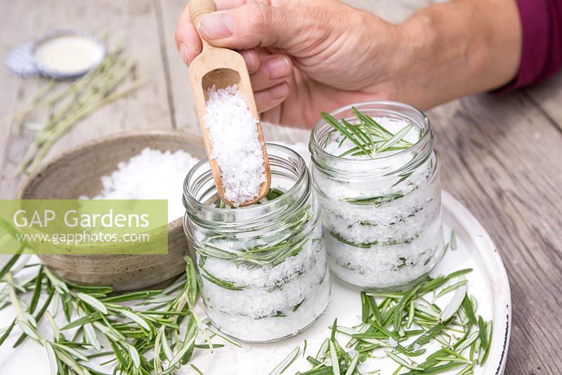 In glass jars create layers of sea salt then rosemary leaves until the jar is full
