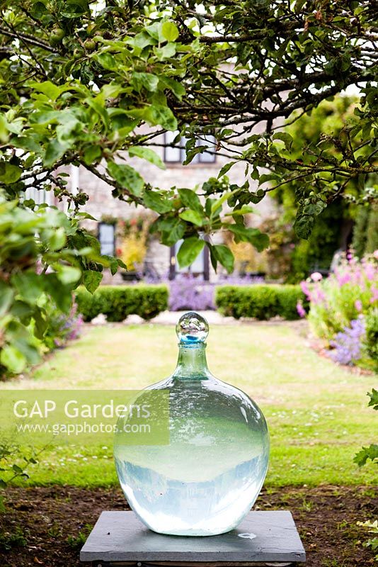 Bottle sculpture on plinth. View to back of house. Orchard House, Sedbury, Gloucestershire. June 2015. 