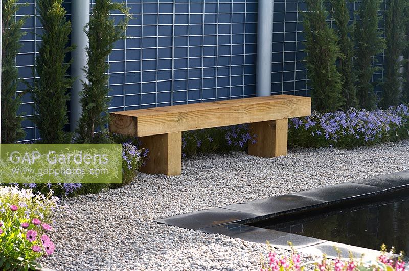 Wooden bench in minimal garden