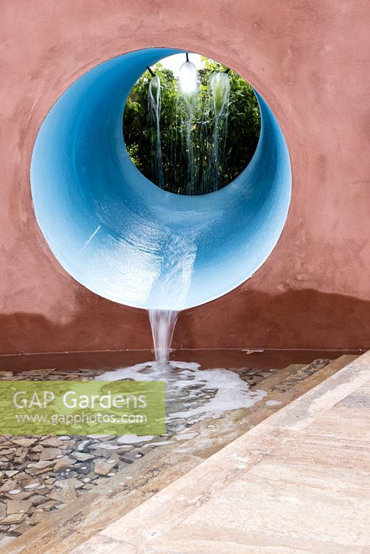 Blue water tunnel channelling water into a pool.  Designer: Stefano Passercotti, Sponsored by Sabo Oil