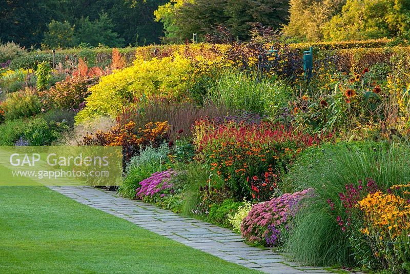 The famous double mixed herbaceous border in september stretching 128 metres down the hill. RHS Garden, Wisley, Surrey 