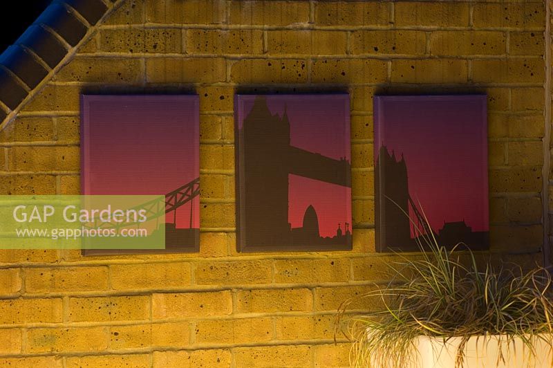 Outdoor weather proof canvas prints on brick wall with lighting on Wapping Balcony
