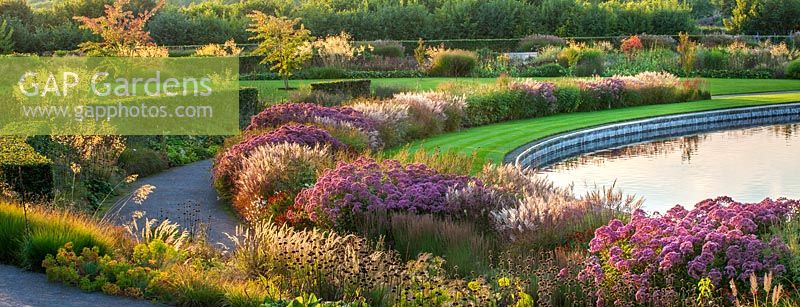 Borders by Tom Stuart-Smith next to lake, September, RHS Garden, Wisley, Surry. 