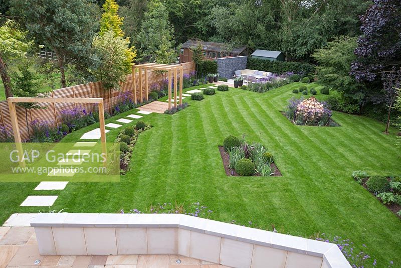 View from balcony to the path leading through the garden to the sunken seating area