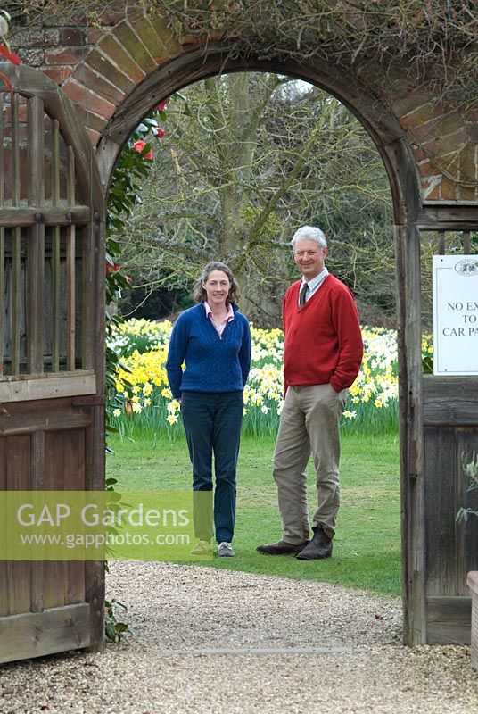 Rupert and Sara Eley by the entrance to the walled garden. Owners of The Place For Plants, Suffolk, April. 