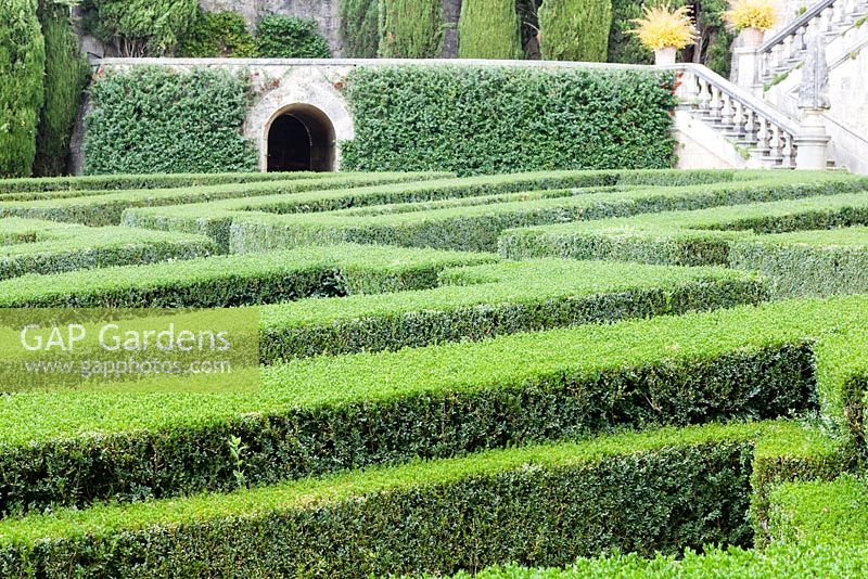 The Lower Garden: view across the box hedges, Villa La Foce, near Chianciano Terme, Siena, Tuscany, Italy. October.