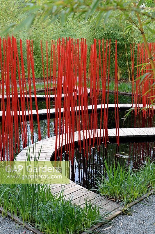 Water pathway with red stakes - Festival international des jardins de Chaumont-sur-Loire, France