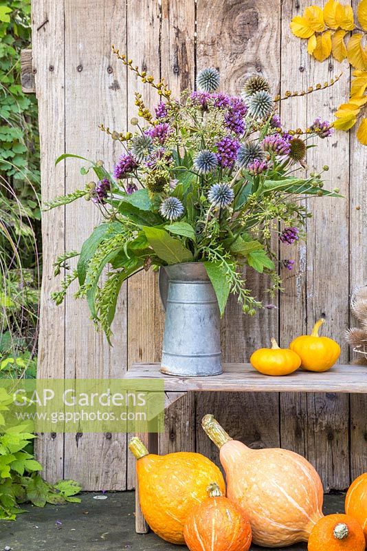 A rustic autumnal bouquet made with Verbena bonariensis, Echinops ritro, Echinacea Large Flowered, spent Japanese anemone and seed heads of Dill, Comfrey and Crocosmia.