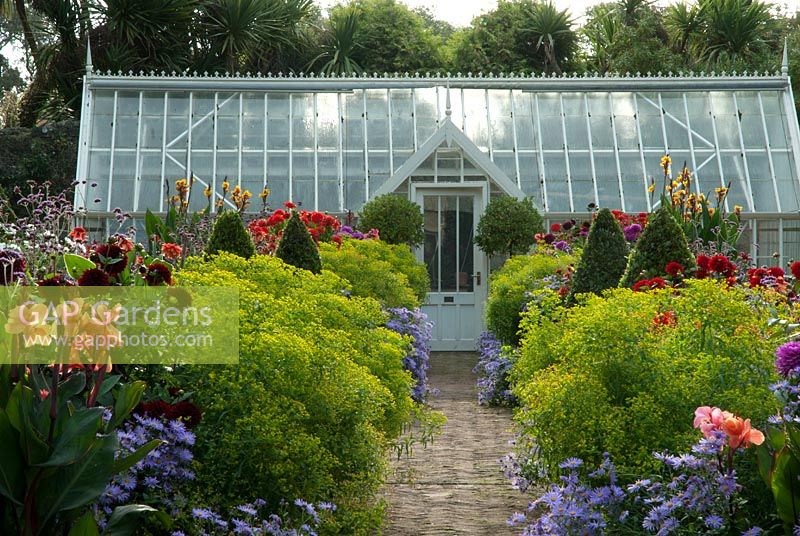 Haddon Lake House, St Lawrence, Isle of Wight. Late Summer Borders with Greenhouse