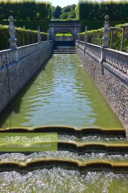 A moat of water bordering the gardens at Chateau de Villandry, Loire Valley, France