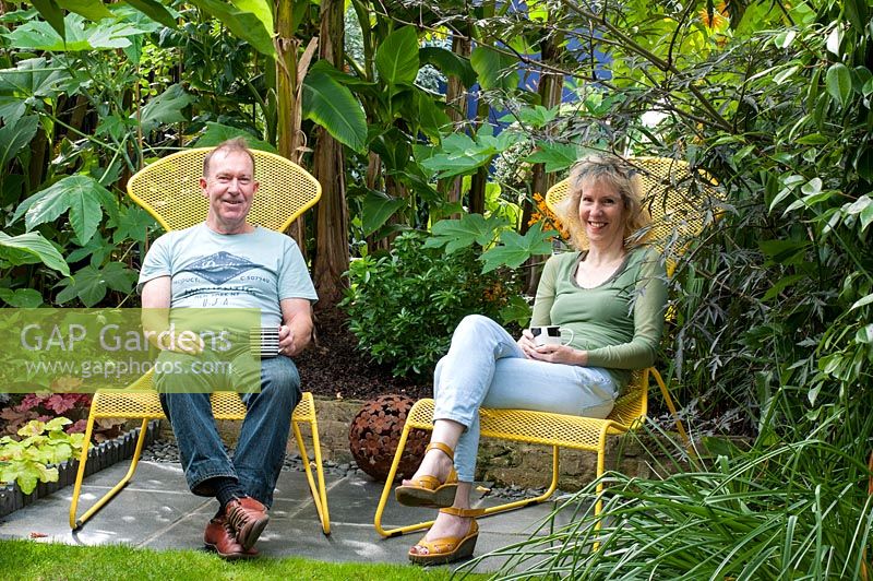 Brian and Julie Linden sitting in their garden