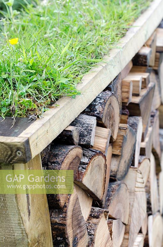 Log wall with green roof - Shears and Chardonnay, RHS Malvern Spring Festival 2014