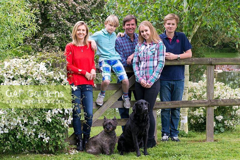 The Inglis family in their garden. Left to right: Victoria, Ludo, Jack and teenagers Luella and Freddie. Flora, black labrador, and Fergus, a Cairn terrier.