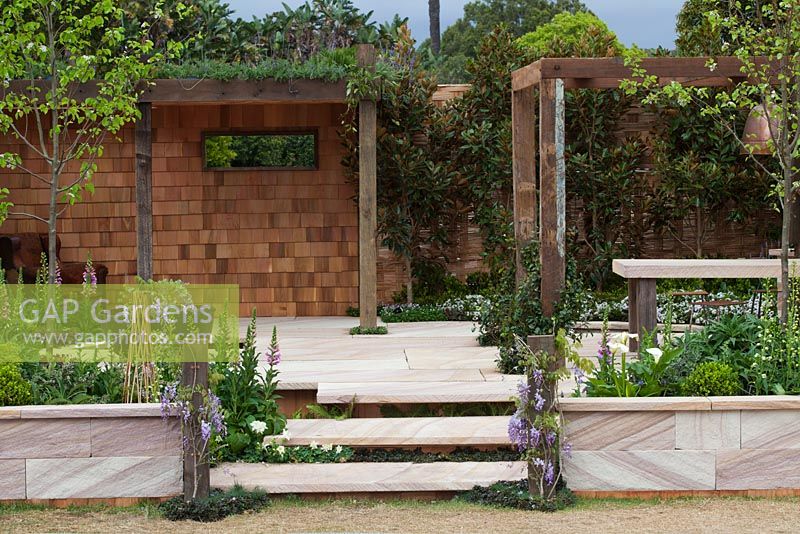 Detail of English style garden, with recycled timber pergola.