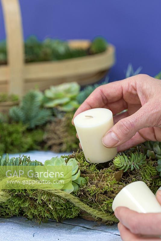 Place the candles inside the Peat free fibre pots