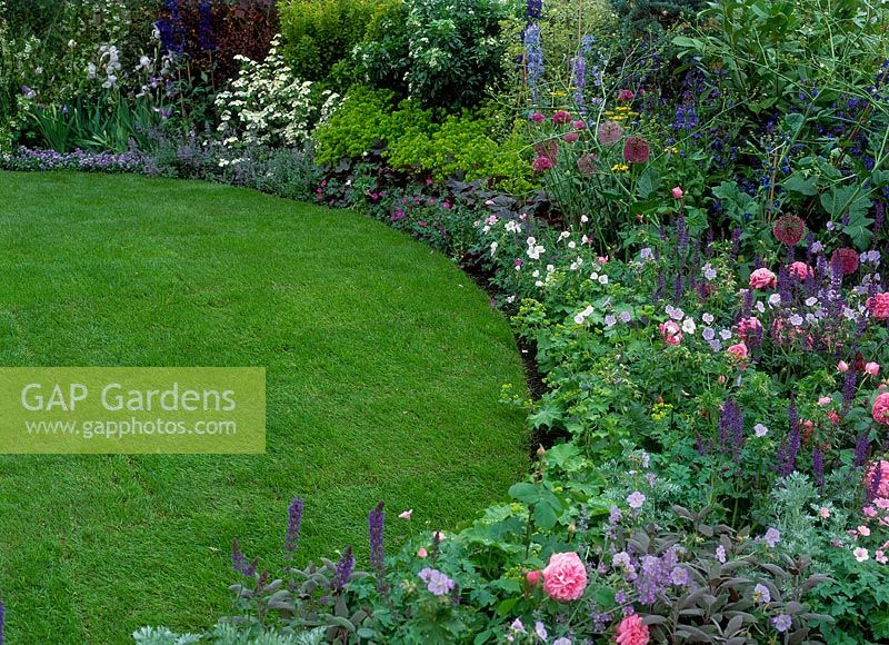 Purple and pink border with manicured lawn, Chelsea flower show, Marie Curies garden of discovery, Design: Patrick Mccann, 2002