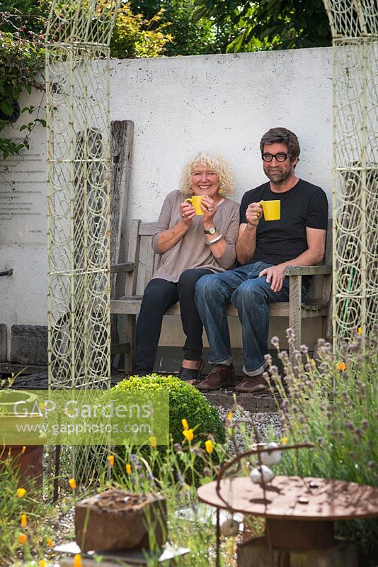 Elaine Pamphilon and Christopher Marvell in their courtyard garden.