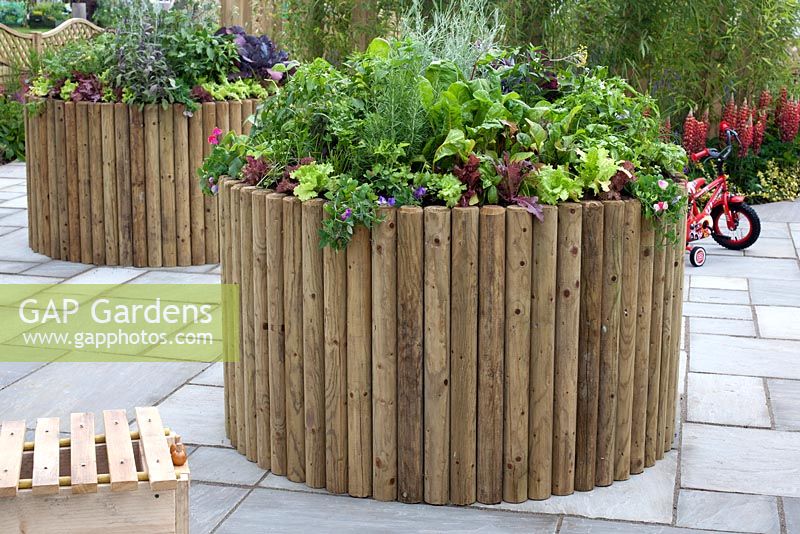 Raised vegetable beds in 'It Makes Sense' Garden at RHS Tatton Flower Show 2015