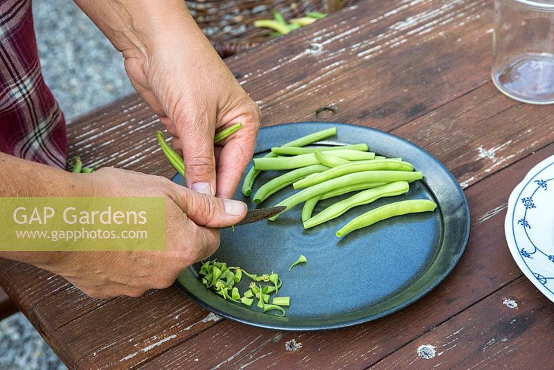 Removing the ends of French beans