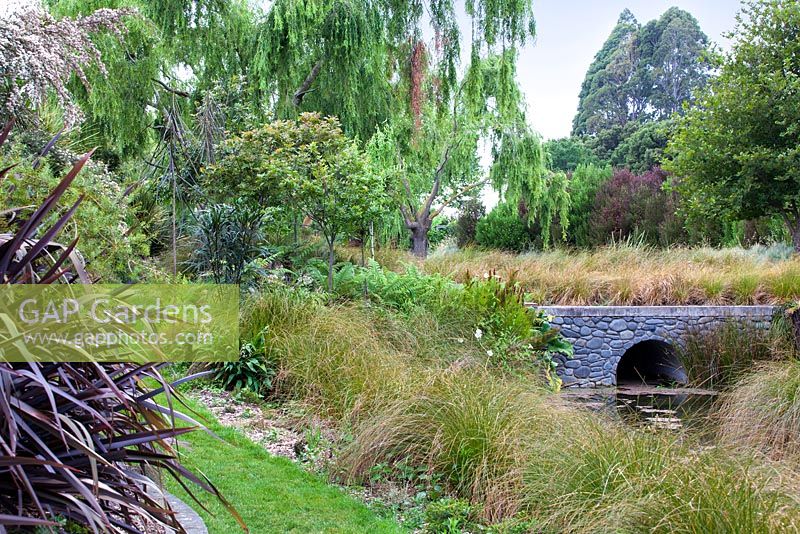 Stone bridge at Bhudevi Estate garden, Marlborough, New Zealand.