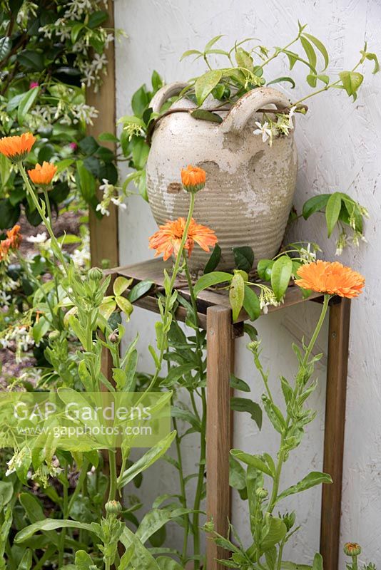 Calendulas and decorative pot - OIKOS, Designer: Mathieu Locret et al, Festival International des Jardins 2016, Domaine de Chaumont sur Loire, France