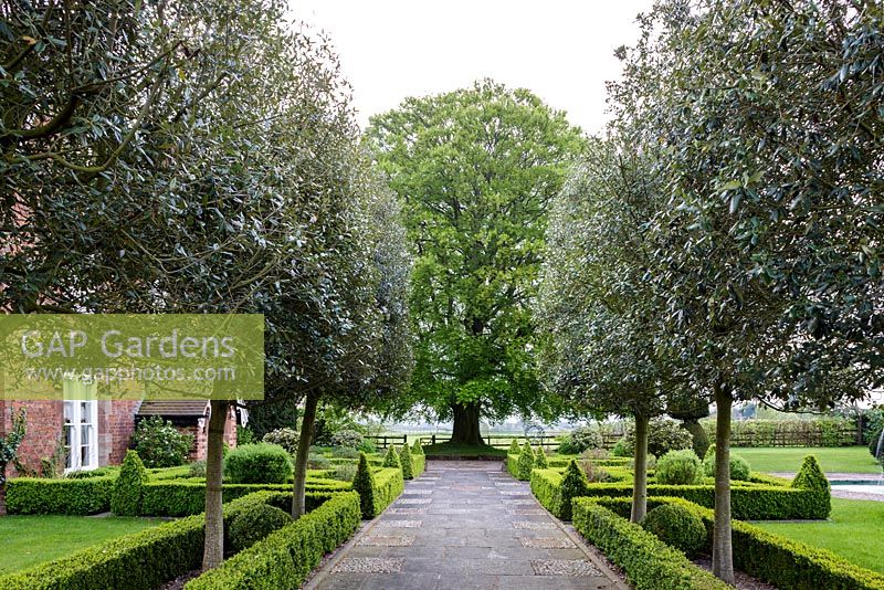 Mitton Manor Garden in spring, Staffordshire. Formal parterre front garden