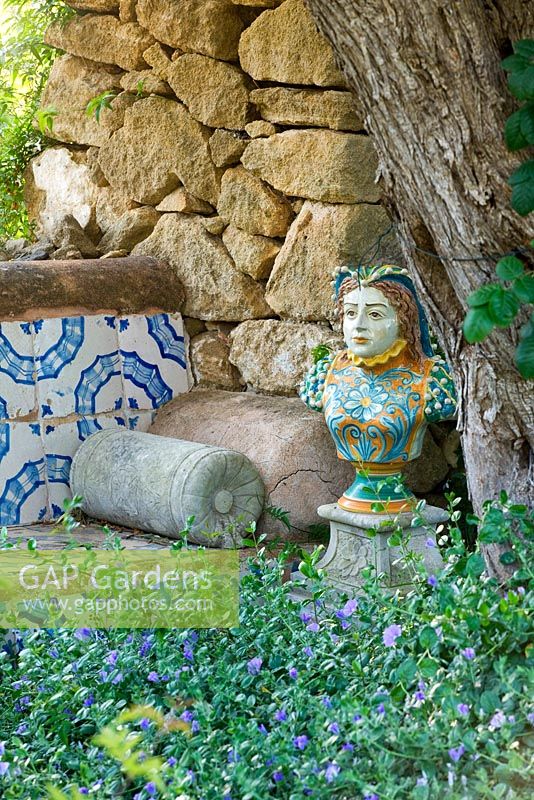 Bust of Catherine de Medici in the seating area in the arabic garden. San Giuliano Estate. Sicily, Italy