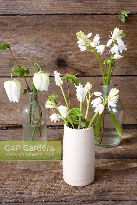 White spring floral arrangement with Fritillarias, muscari and hyacinthoides