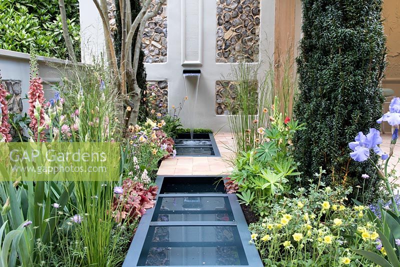 Water feature with associated planting. Pro Corda Trust - A Suffolk Retreat, RHS Chelsea Flower Show 2016 - Design: Frederic Whyte, Sponsor: Pro Corda Trust