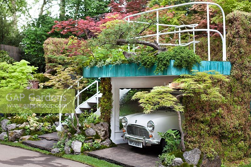 Senri-Sentei Garage Garden, depicting a two tier structure housing an antique mini, with a roof garden and area for the family to sit and relax - RHS Chelsea Flower Show 2016, Designer: Kazyuki Ishihara, Sponsor: Senri-Sentei Project