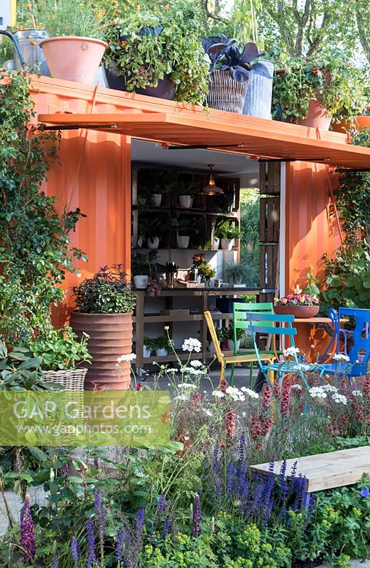 RHS Greening Grey Britian for Helath, Happiness and Horticulture a view into converted container into a garden room. RHS Chelsea Flower Show 2016. Design: Ann-Marie Powell