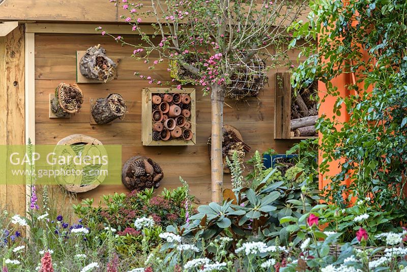 Bug hotels in the RHS Greening Grey Britain for Health, Happiness and Horticulture Garden. RHS Chelsea Flower Show 2016 - Designer: Annie-Marie Powell