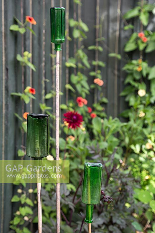 Glass bottles used as cane toppers
