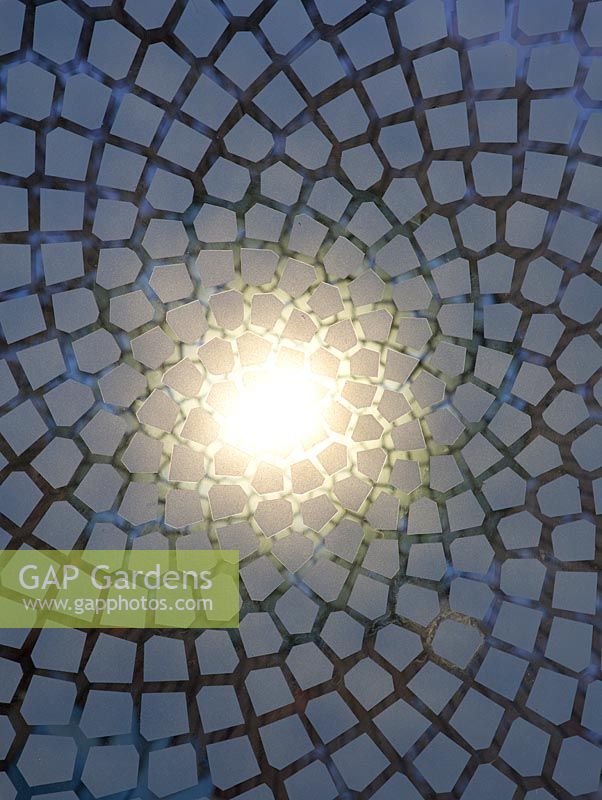 Detail of illuminated glass panels emulating the mathematically perfect Fibonacci spiral inset into the wooden floor of the belvedere in the Winton Beauty of Mathematics, RHS Chelsea Flower Show 2016.
