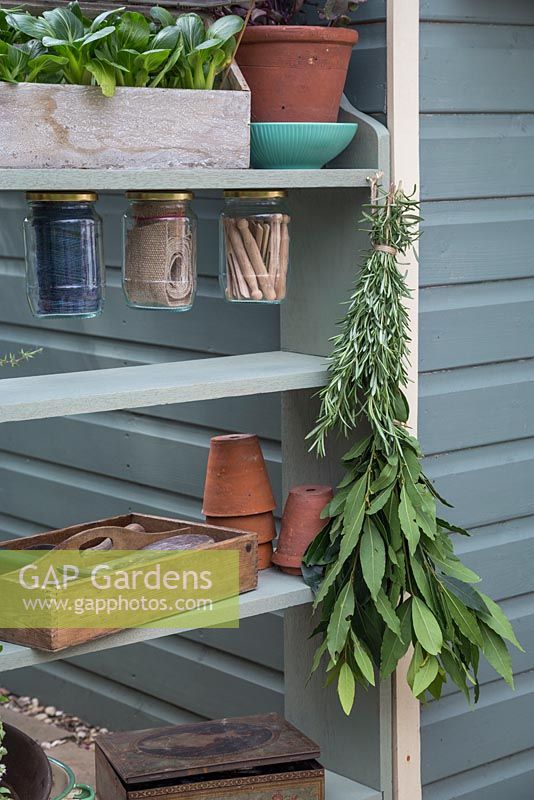 A gardening storage unit made from upcycling book shelves
