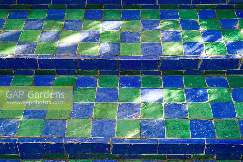 Green and blue tiled steps in the Jardin Majorelle. Created by Jacques Majorelle and further developed by Yves Saint Laurent and Pierre BergÃ©, Marrakech, Morocco
