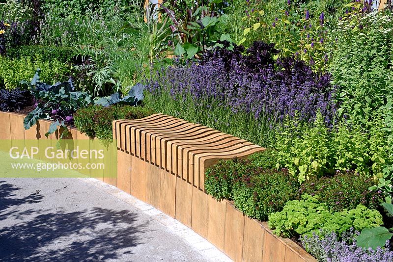 Witan Investment Global Growth Garden. Built in timber bench in raised bed. Designer: Jane Bailey Sponsors: Witan Investment. RHS Hampton Court Palace Flower Show 2016
