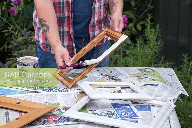 Repaint the picture frame over some newspaper