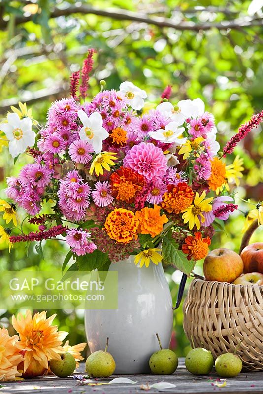 Jug of late summer flowers: Dahlia, Sunflower, Persicaria, Asters, Anemones, Marigolds.