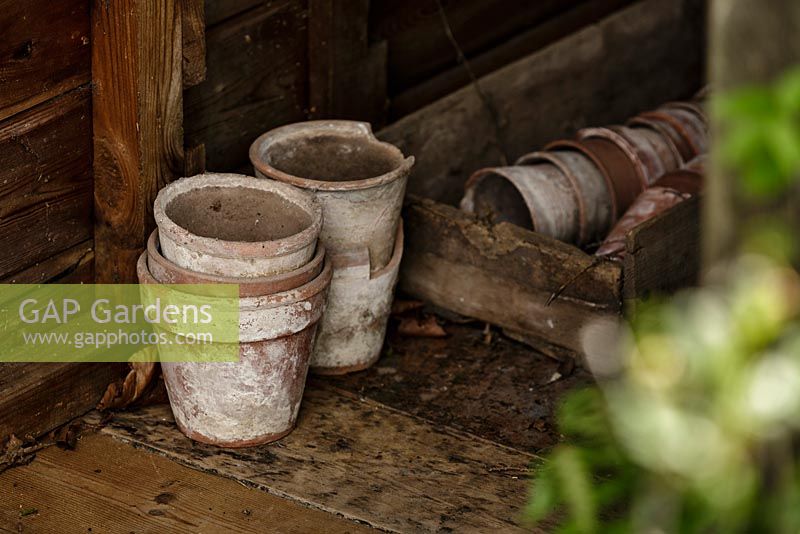Detail of terracotta pots inside shed - Macmillan Legacy Garden - RHS Malvern Spring Show 2016