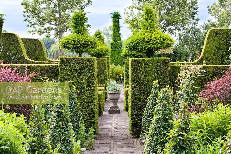 Formal garden with perennial borders, topiary and hedging. Frank Thuyls garden.