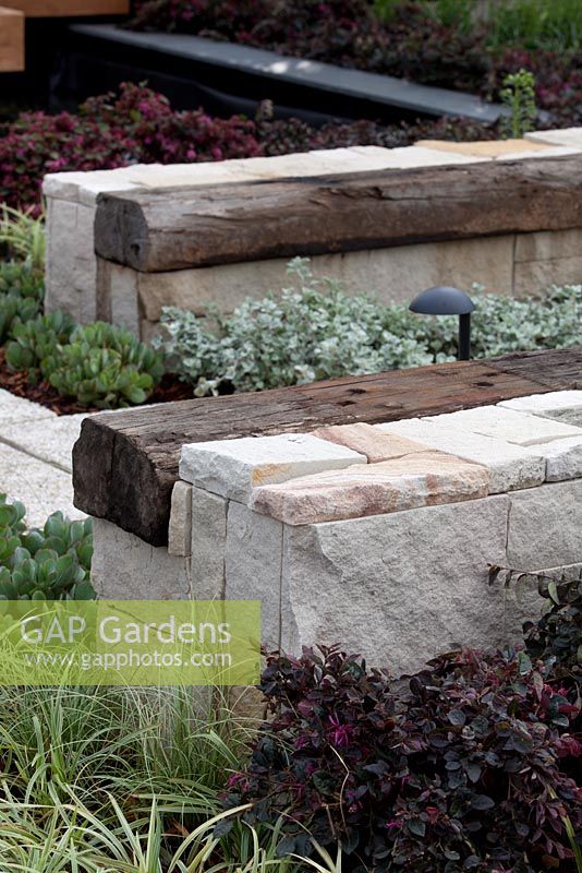 A recycled bench using sandstone blocks and timber 