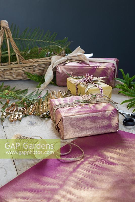 A present spray painted gold with an imprint of Fern foliage