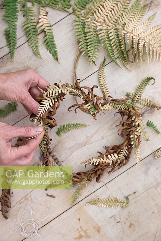 Use string to attach the different textured Ferns to the wreath