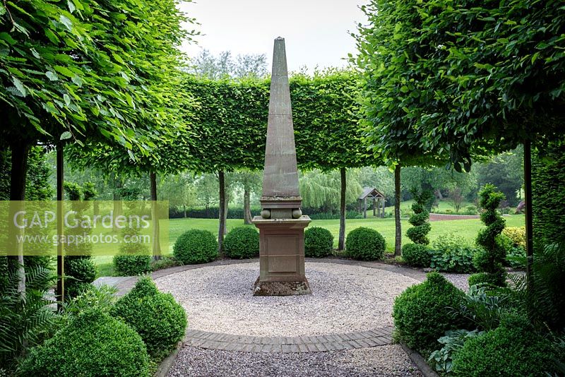 Stone obelisk in formal garden. Mitton Manor, Staffordshire. 