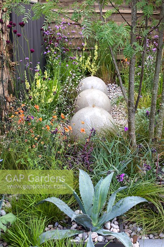 Water features amid wildflower planting in the Eat and Shelter Garden, BBC Gardener's World Live 2016